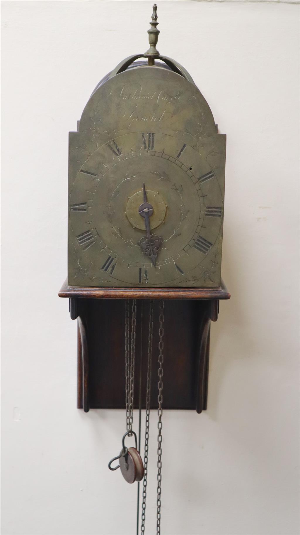 Nathaniel Cavell of Ipswich. A late 18th century brass lantern clock, clock height 13.5in. width 7.5in., overall height of wall bracket